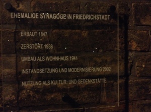 Sign outside the Synagogue: It says: Former Synagogue of Friedrichsstadt Built in 1847 Destroyed by the Nazis in 1938 Used as a Private Home in 1941 Rettsored to the Jewish Community in 2002 Now used as a Cultural Center